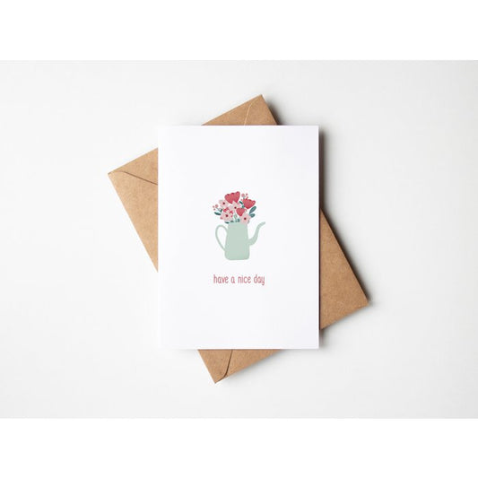 Wenskaart have a nice day en een boeket bloemen om positiviteit te verspreiden met bijhorende enveloppe